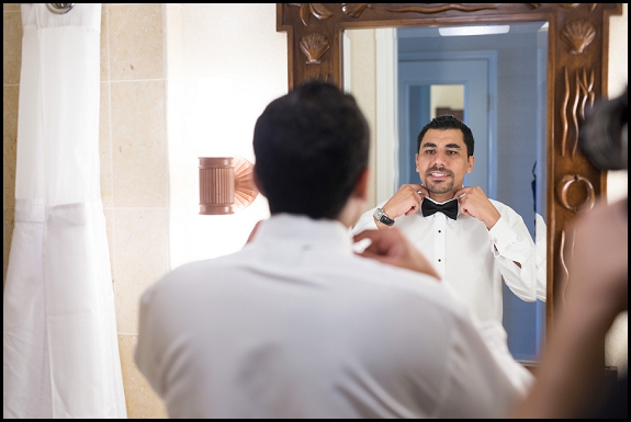 groom getting ready for wedding at hyatt regency resort and spa in huntington beach