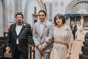 groom escorted by parents